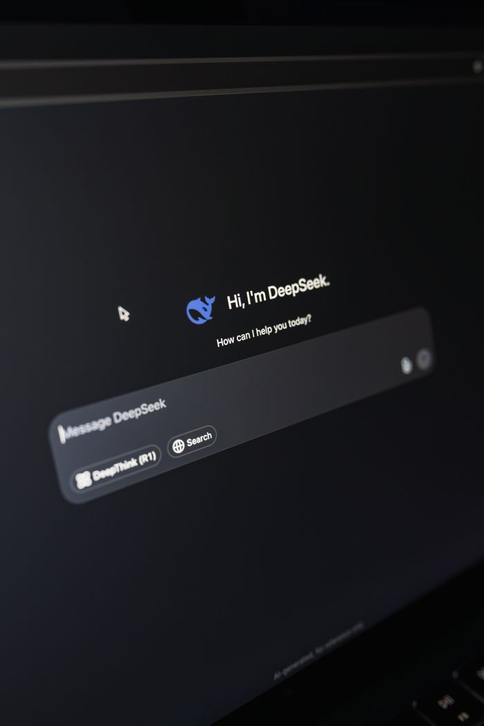 The Art of Drawing Readers In: Your attractive post title goes here Close-up of a laptop displaying an AI interface with a chatbot prompt in dark mode.